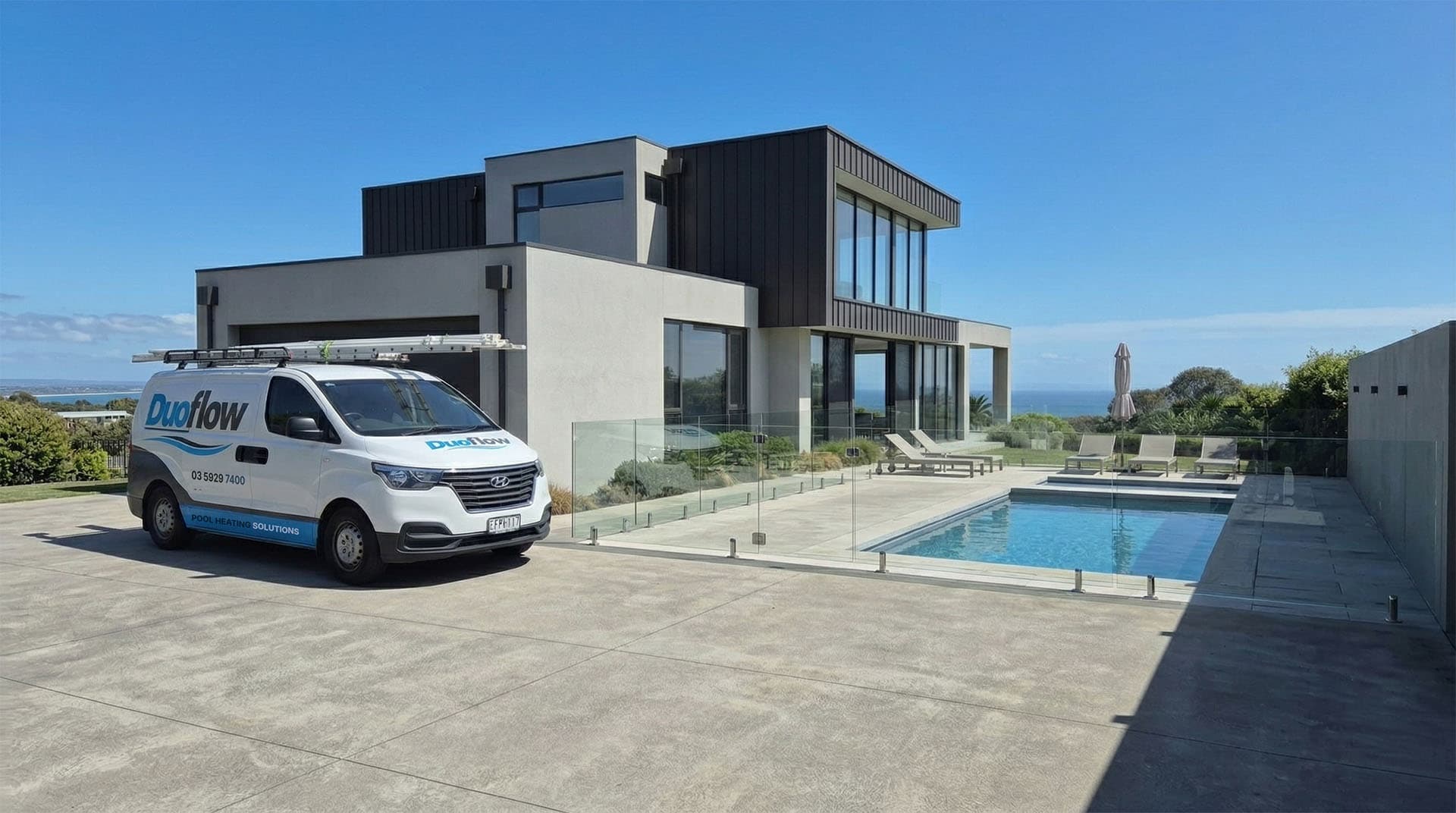 DuoFlow service van beside a swimming pool at a modern coastal home