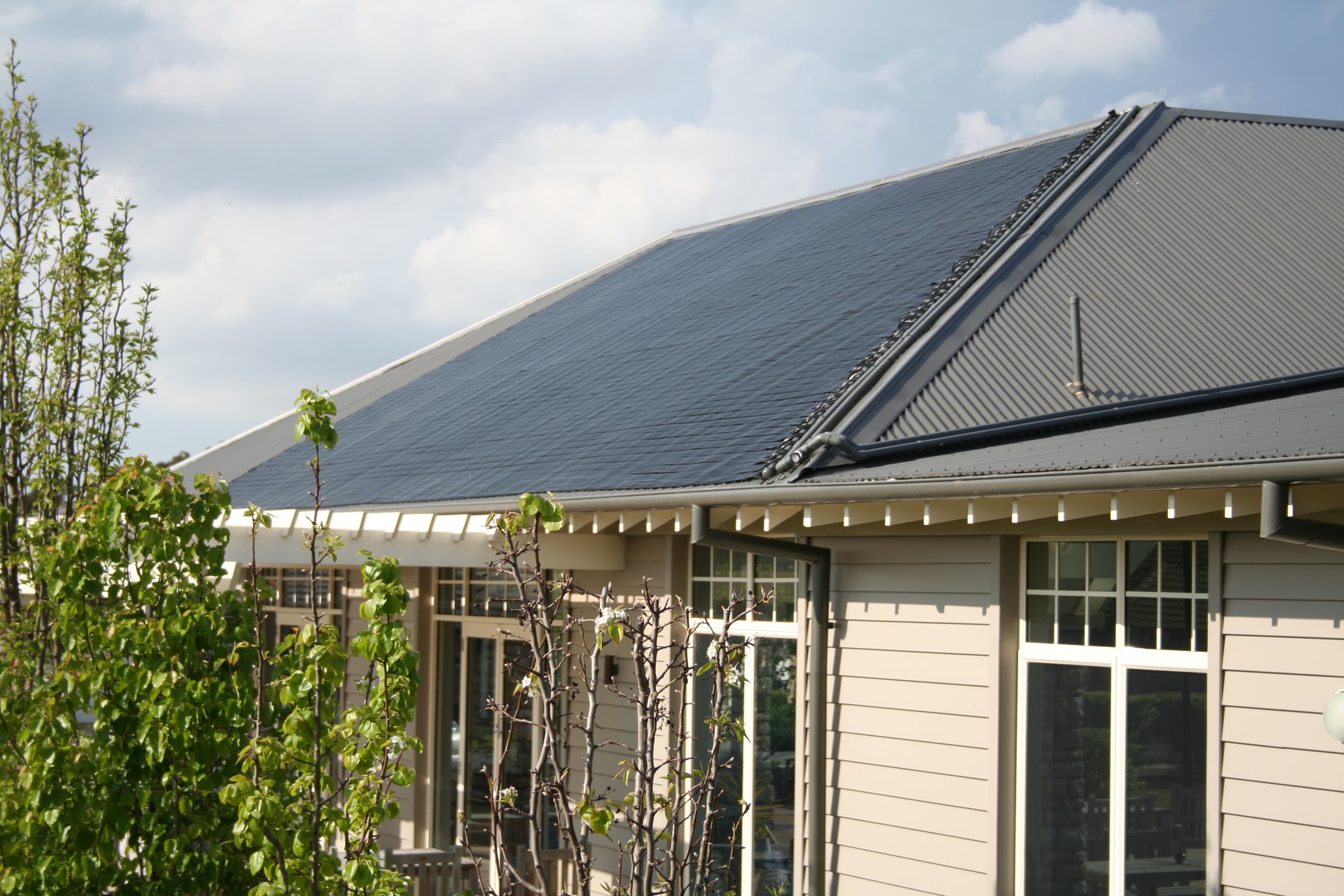 Sunbather flexible strip solar pool heating installed on a home